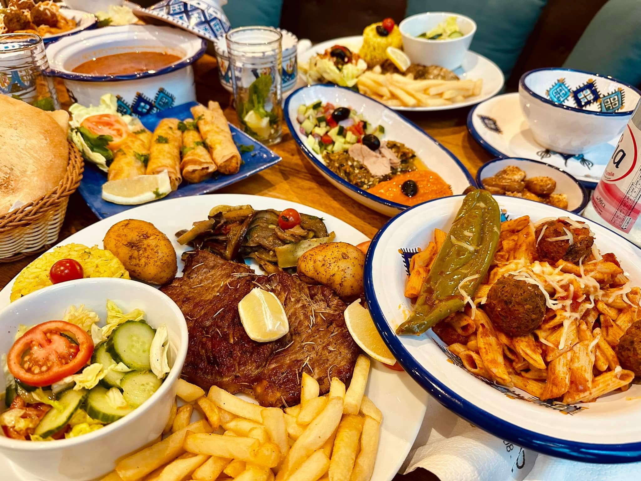 COSTE dinner feast — Tunisian meat, pasta and salads